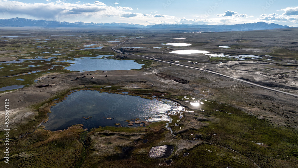 landscape of the surroundings of the village of Kosh Agach mountains with lakes and unusual landscapes from the height of a drone flight in the southern regions of Altai in May landscape of the surroundings of the village of Kosh Agach mountains with lakes and unusual landscapes from the height of a drone flight in the southern regions of Altai in May