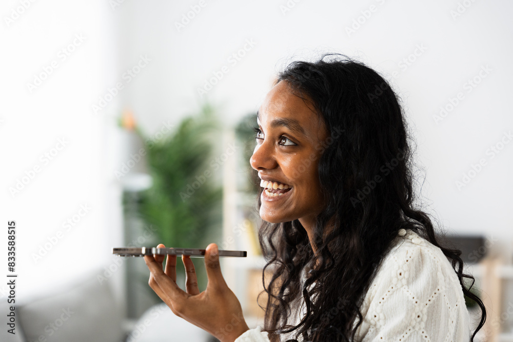 Indian teenager girl sending voice message. Positive young woman using phone. Indian teenager girl sending voice message. Positive young woman using phone.