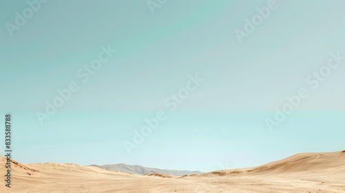Vast yellow sand dunes stretch under a clear blue sky in this hot  dry desert landscape