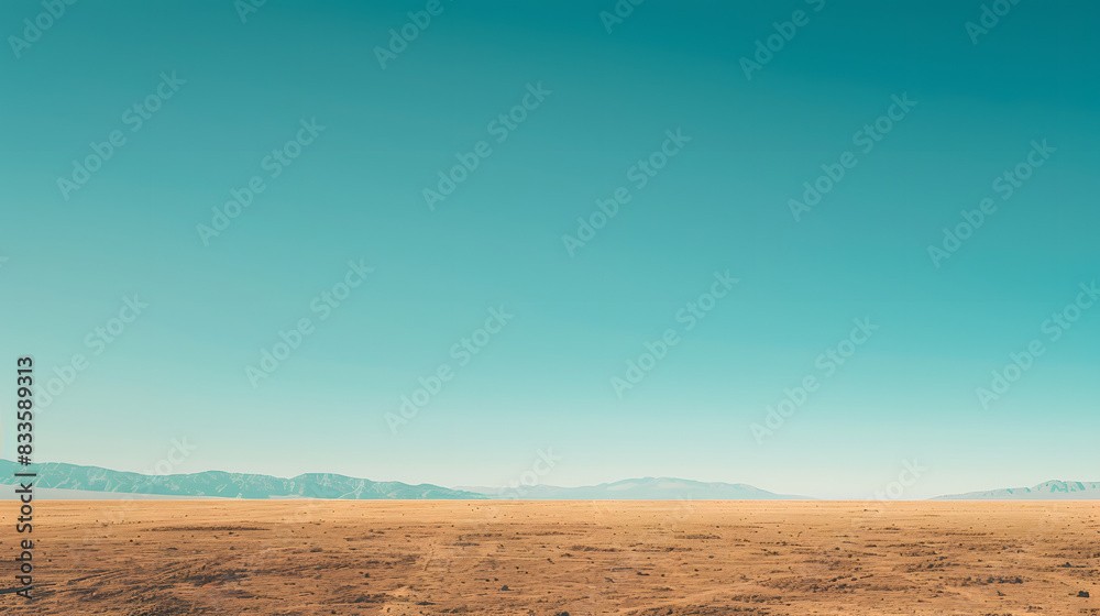 A vast desert landscape with golden sand dunes stretching towards a clear blue sky A vast desert landscape with golden sand dunes stretching towards a clear blue sky