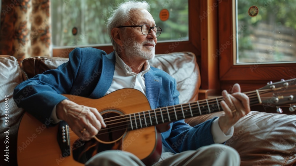 Obraz premium The elderly man with guitar