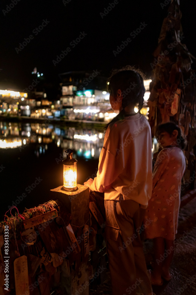 My family with a lamp Night view at Pilok, Kanchanaburi Ban E-Tong in Pilok Thailand