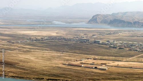 Tiger Mountain Great Wall, UNESCO World Heritage Site, near Dandong, Liaoning Province, China, panoramic elevated view of the Yalu River that separates China (left) from North Korea (right)
