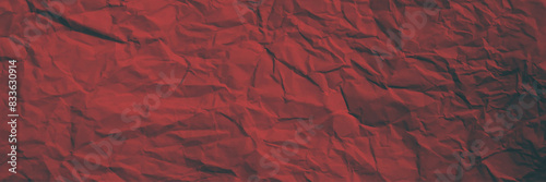 Wrinkled red paper texture background.  Red background and wallpaper by crumpled paper texture and free space.
