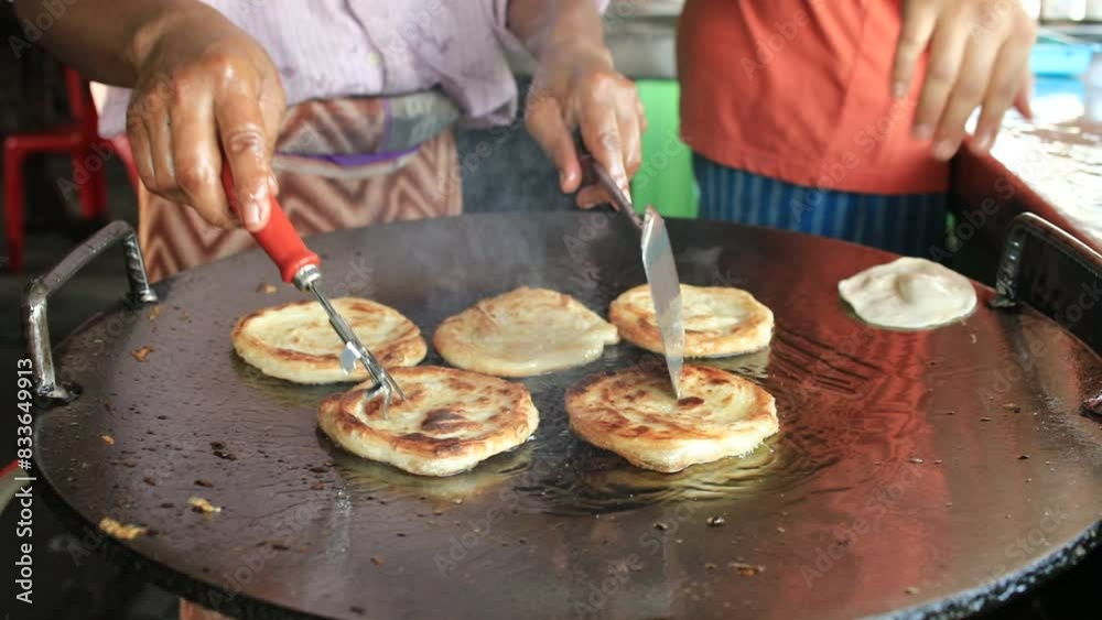 close up man frying roti street food close up man frying roti street food