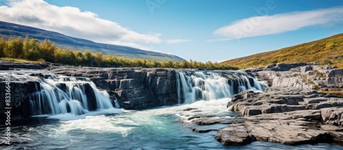 Fototapeta Naklejka Na Ścianę i Meble -  Waterfall in Abisko national Park. Creative banner. Copyspace image