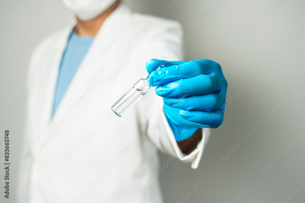 doctor or scientist holding ampules medicine vaccine and bottle for injection doctor or scientist holding ampules medicine vaccine and bottle for injection