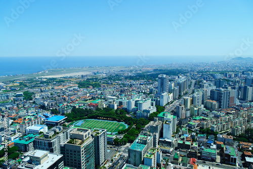 Fototapeta Naklejka Na Ścianę i Meble -  Jeju city in South Korea. Aerial cityscape skyline 