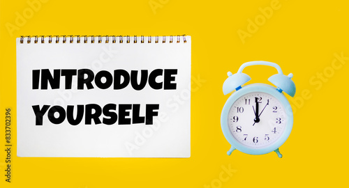 Obraz na płótnie A note with the text Introduce yourself on a yellow background. Self-presentation concept.