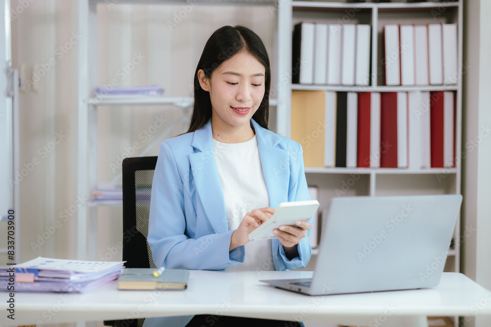 Happy young woman uses laptop computer for virtual meeting Have a video call at home Cheerful Asian woman communicating with colleagues and friends Happy young woman uses laptop computer for virtual meeting Have a video call at home Cheerful Asian woman communicating with colleagues and friends