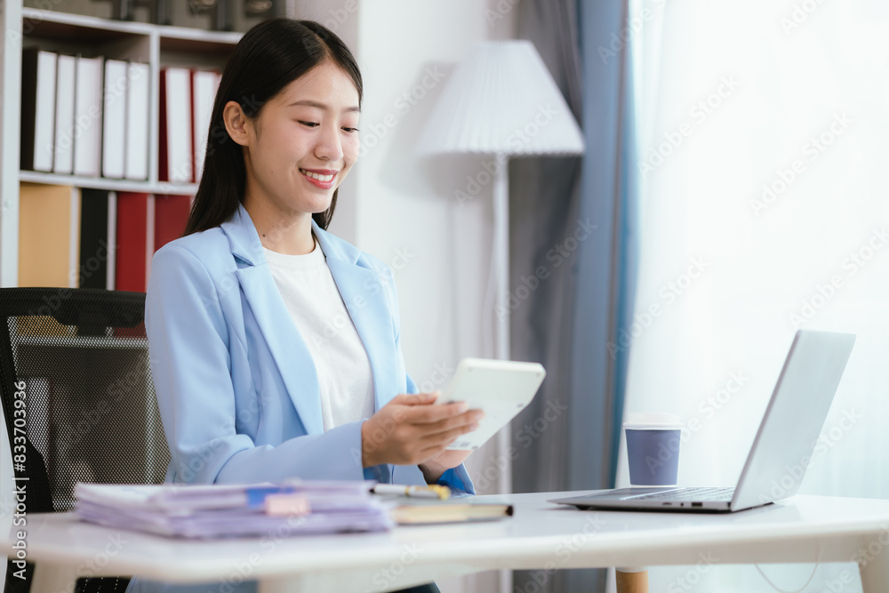 Happy young woman uses laptop computer for virtual meeting Have a video call at home Cheerful Asian woman communicating with colleagues and friends Happy young woman uses laptop computer for virtual meeting Have a video call at home Cheerful Asian woman communicating with colleagues and friends