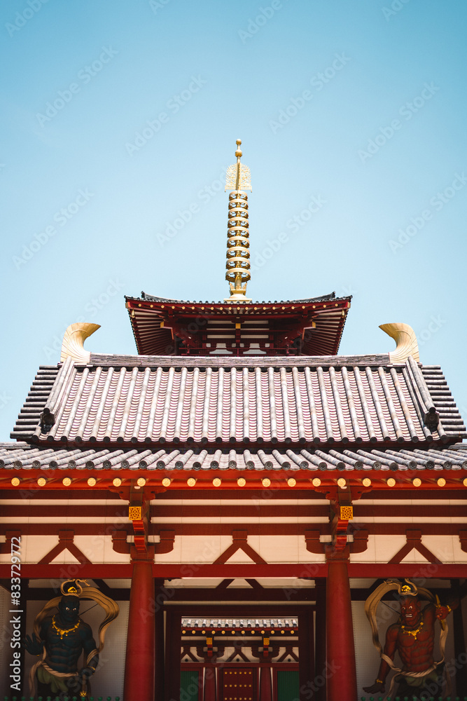 Asian sculpture in front of an oriental structure
