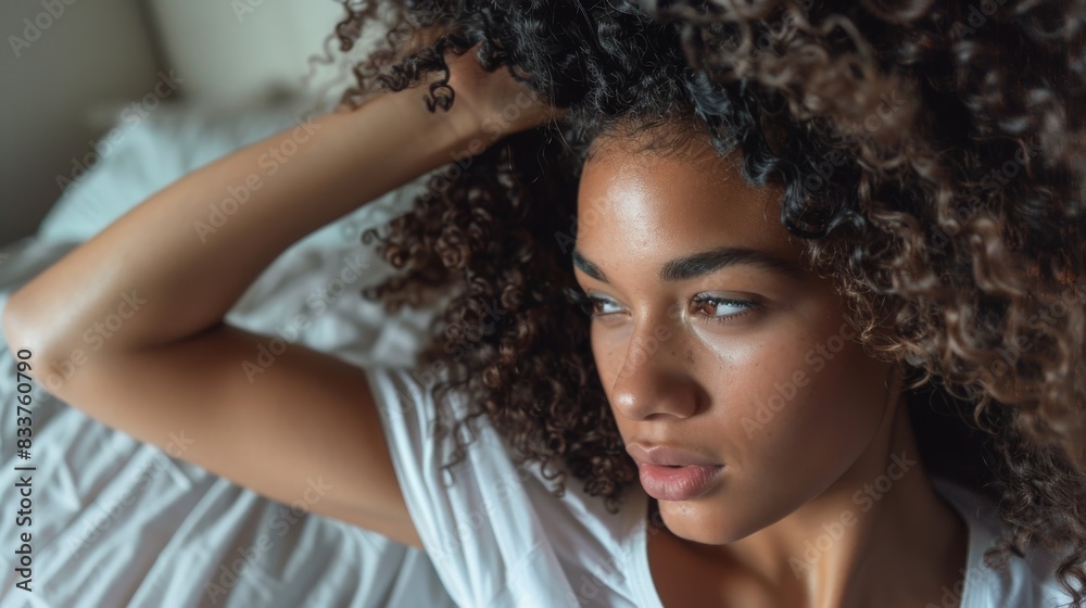 Curly girl method, Healthy routine for beautiful curls. Smiling woman with voluminous curls combing her hair. Curly girl method, Healthy routine for beautiful curls. Smiling woman with voluminous curls combing her hair.