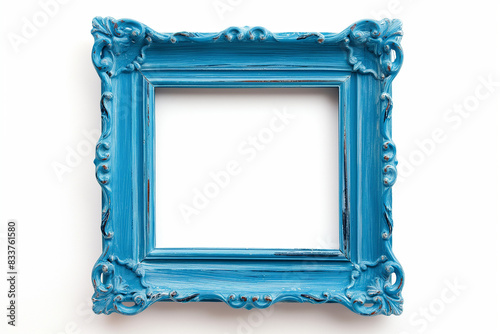 Empty classic vintage frame painted in blue on white background with shadows. Frame for picture in art gallery, mockup for advertisement message or inscription. Luxurious vintage. Retro decor, mock up