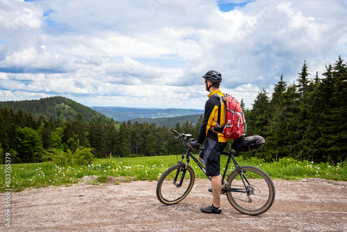Cyclist on a Mountain Bike Tour Enjoying the View Over the Thuringian Forest