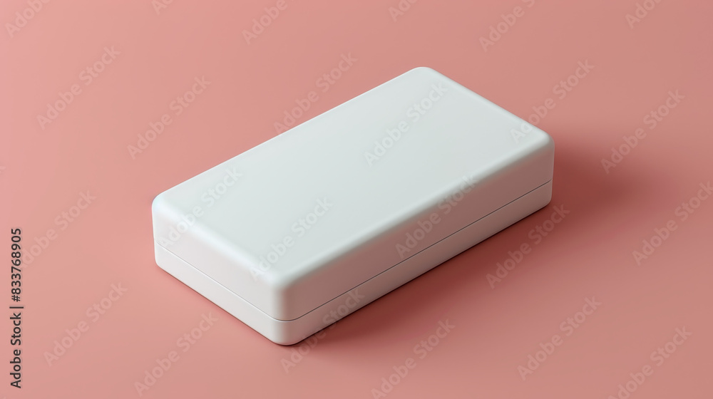 A white box sits on a pink surface A white box sits on a pink surface