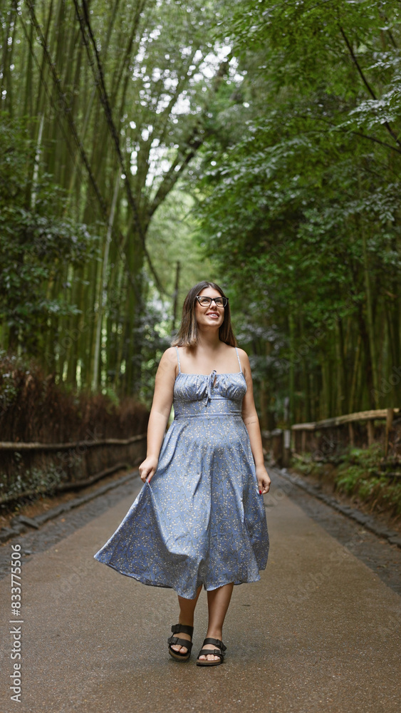 Beautiful hispanic woman with glasses, smiling confidently as she stands amongst kyoto's lush bamboo forest, looking around, full of joy and amazement. Beautiful hispanic woman with glasses, smiling confidently as she stands amongst kyoto's lush bamboo forest, looking around, full of joy and amazement.