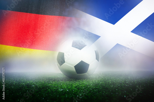 group A stage match , Germany vs Scotland , Football Nation Flag and soccer ball on green grass photo