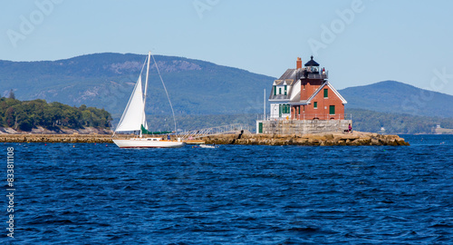 Rockland Breakwater lighthouse lies at the end of a long stone breakwater