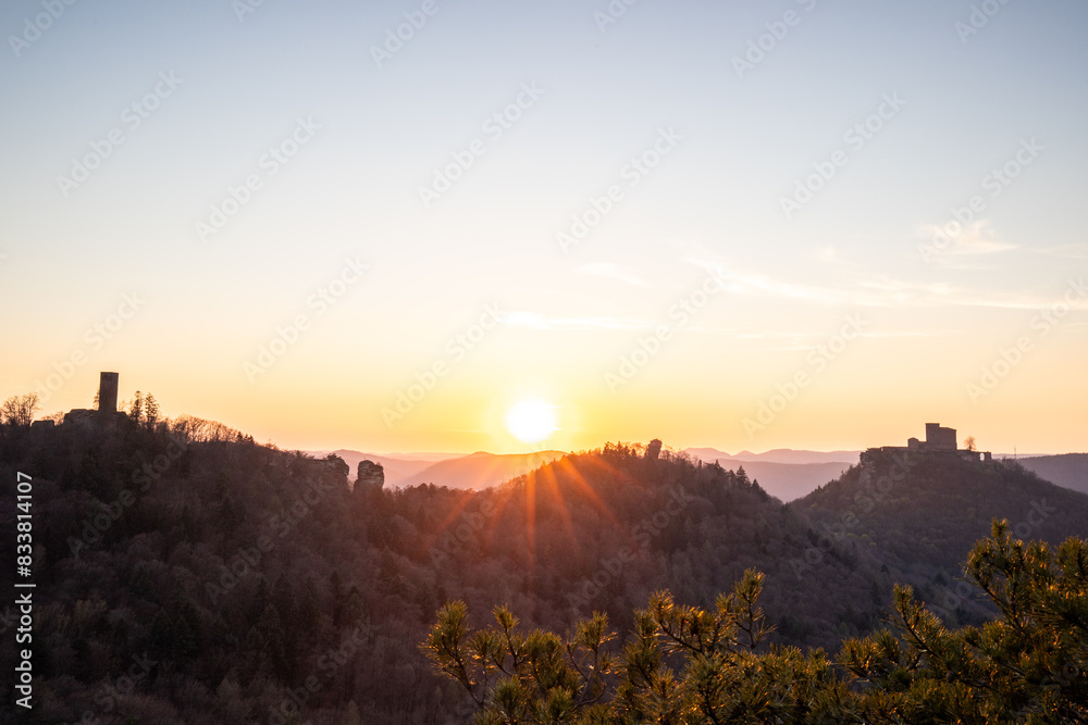 View of Trifels Castle, from Engels Landing rock, with the Jungturm in autumn at sunset. Beautiful landscape in the Palatinate Forest, Rhineland Palatinate, Germany View of Trifels Castle, from Engels Landing rock, with the Jungturm in autumn at sunset. Beautiful landscape in the Palatinate Forest, Rhineland Palatinate, Germany