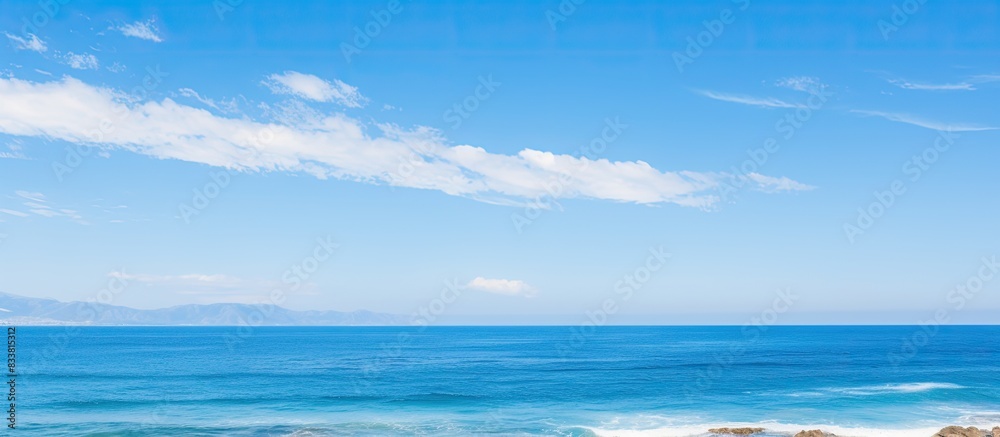 Obraz premium Scenic ocean view landscapes under a clear blue sky with copy space image.