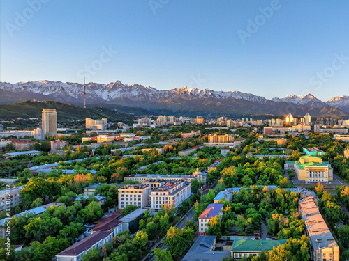View from a quadcopter of the central part of the Kazakh city of Almaty on a spring morning against the backdrop of a mountain range