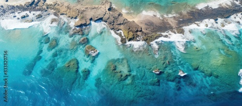 Aerial view of the ocean showing reefs  road  and coastline with plenty of copy space image available.