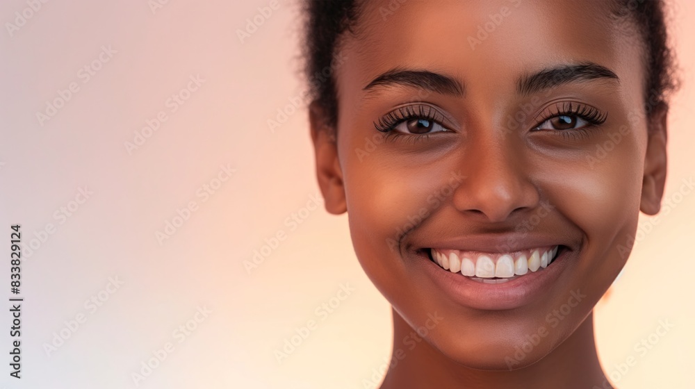Portrait of a Black woman smiling with white teeth in a makeup campaign Portrait of a Black woman smiling with white teeth in a makeup campaign