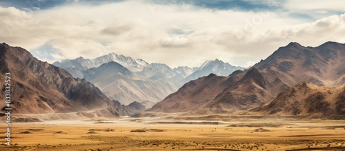 The scenic route leading to Leh showcases breathtaking mountain landscapes and serene surroundings, perfect for capturing a picturesque copy space image. photo