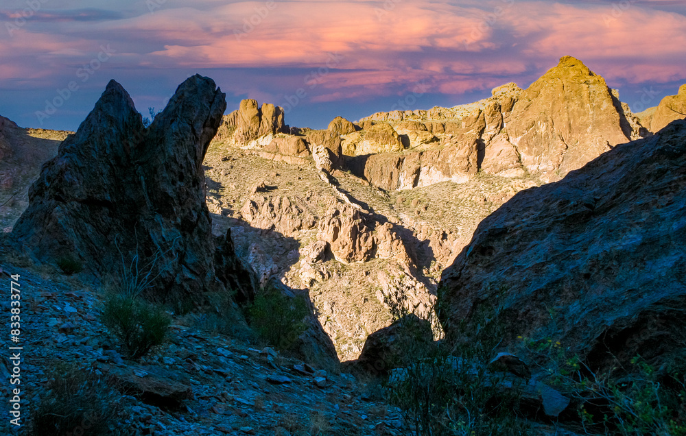 Fototapeta premium Mountains illuminated by the evening sun against a cloudy sky, Arizona