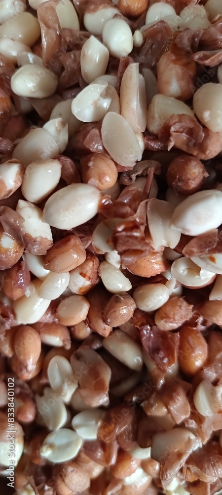 Fototapeta premium Peanuts are being peeled