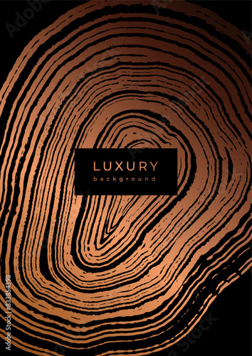 Luxury golden background with wood annual rings texture. Template with shiny tree ring pattern. Stamp of tree trunk in section. Wooden concentric circles. Black and bronze gold background