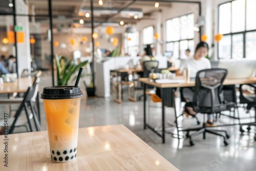 Bubble tea cup in office startup delivery summer refreshment work environment entrepreneurship asian fresh drink sweet natural beverage tasty desk busy morning leisure time short break trendy