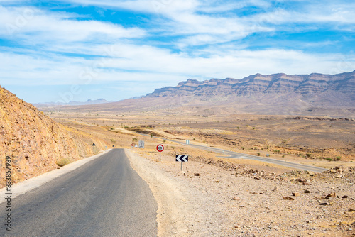 Road in desert landscape of Atlas Mountains near Tamnougalt village  Morocco  North Africa