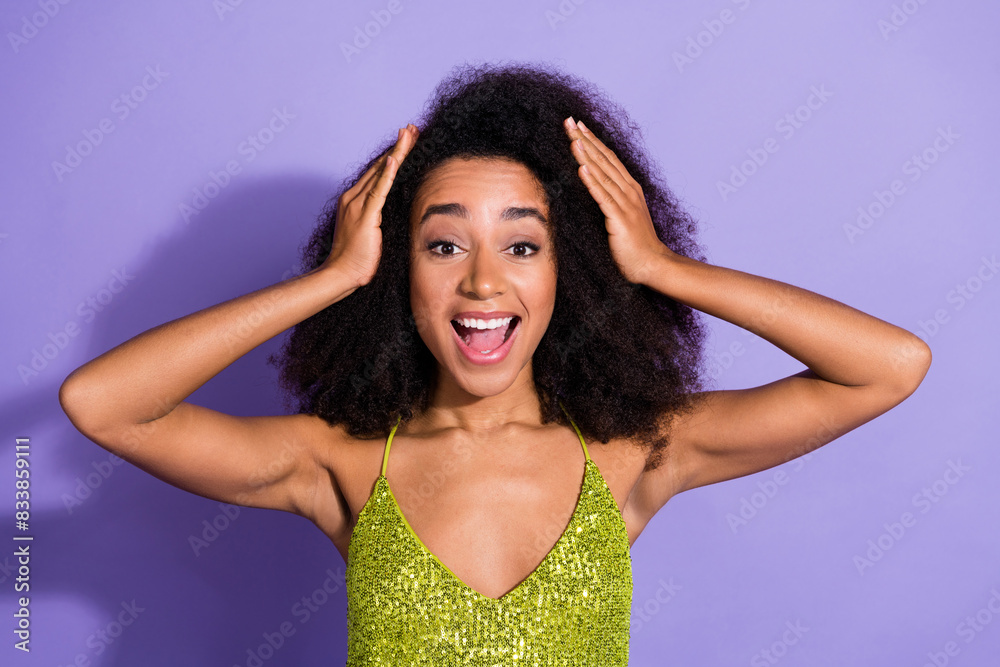 Photo portrait of gorgeous young girl amazed touch head wear trendy green sequins outfit isolated on purple color background Photo portrait of gorgeous young girl amazed touch head wear trendy green sequins outfit isolated on purple color background