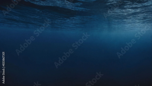 Dark blue ocean surface seen from underwater with copyspace, 16:9, 300dpi