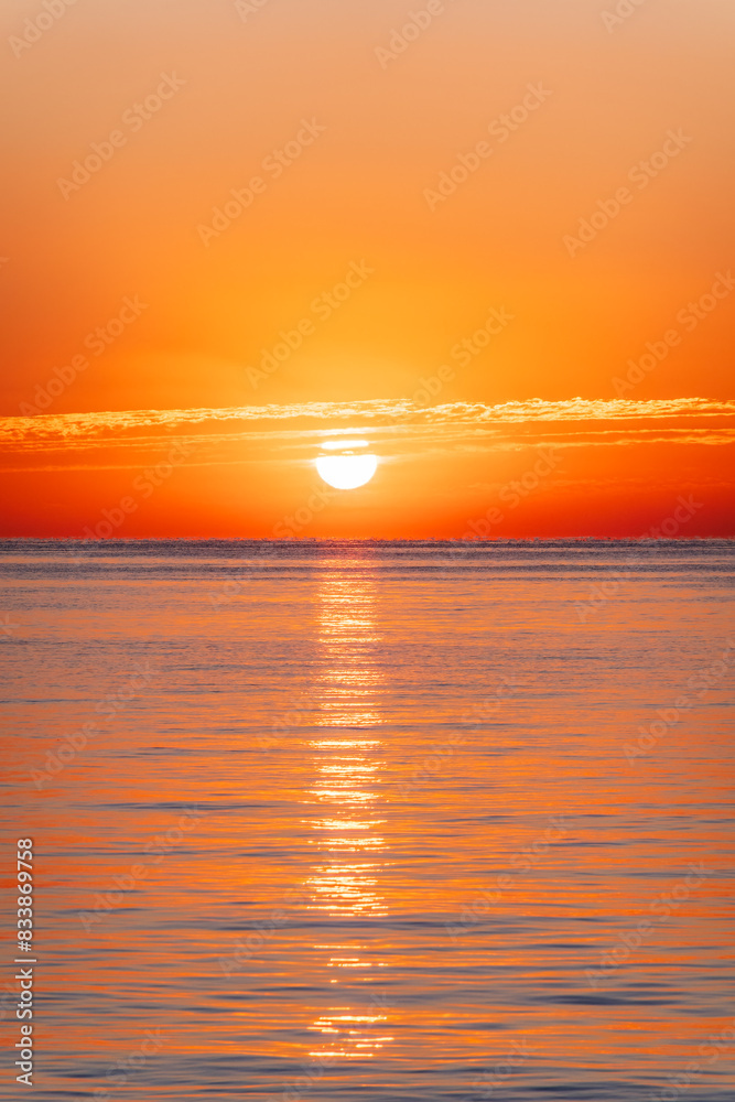 Fototapeta premium Beautiful red and orange sunrise over the sea.