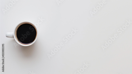 Minimalist Flat Lay of a White Coffee Cup Filled with Black Coffee