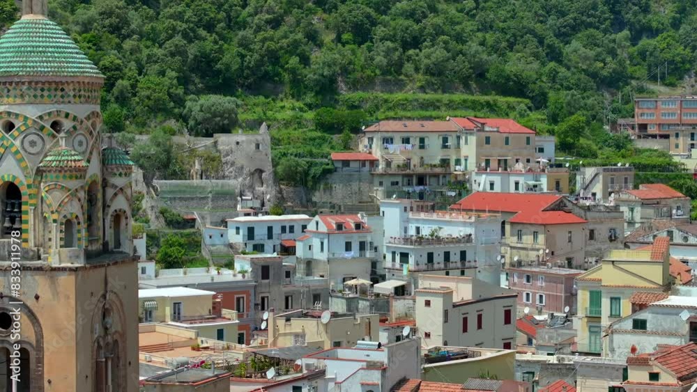 Aerial drone fly of Maiori resort village, Amalfi coast, Italy, Beautiful Italian Villa on a rocky seashore by the Porto di Maiori Aerial drone view of scenic Mediterranean Town with the blue sea. 