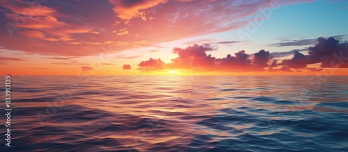 A stunning sunset with a picturesque horizon over the ocean, ideal for a copy space image.