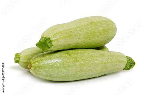 three fresh zucchinis isolated