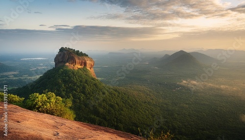 spectacular view of the lion rock surrounded by green rich vegetation picture taken from pidurangala rock in sigiriya sri lanka photo