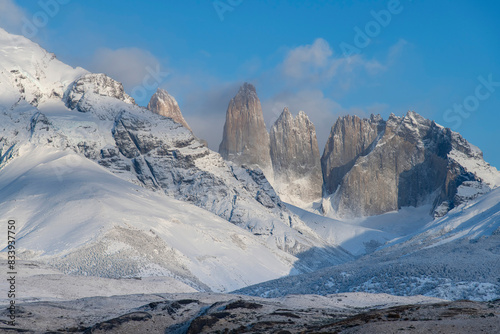 Torres del Paine National Park  Patagonia  Chile  Close up of snow covered Paine Massif mountains with three iconic granite towers  torres  during dawn along the W-trek route