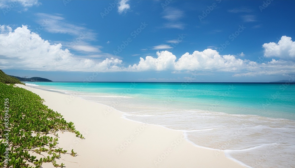 blue sky over a beach with white sand and turquoise water