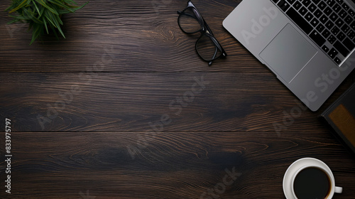 coffee cup and laptop on table with copyspace photo