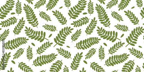 Seamless pattern with abstract leaves and branches. Plant natural print. Vector graphics.