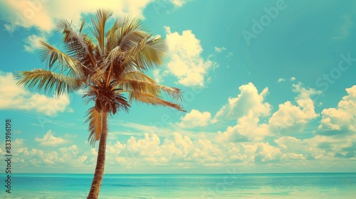 Palm tree on tropical beach with blue sky and white clouds abstract background. Copy space of summer vacation and business travel concept. Vintage tone filter effect color style. © alan