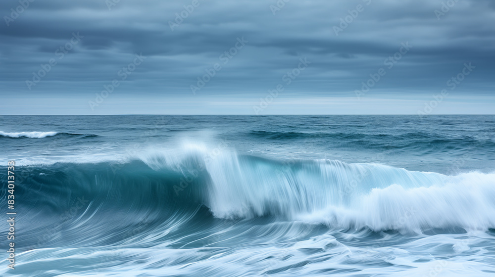 A wide shot of the ocean with waves crashing, capturing the vastness and beauty of nature's elements, overcast sky, powerful A wide shot of the ocean with waves crashing, capturing the vastness and beauty of nature's elements, overcast sky, powerful