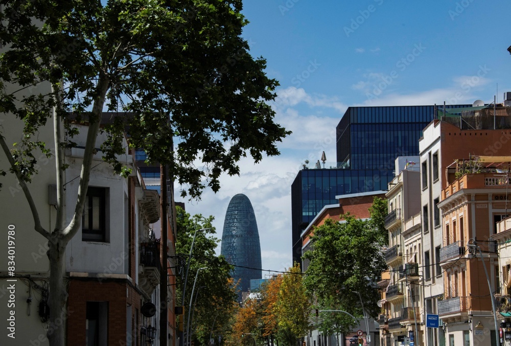 Fototapeta premium street view in Barcelona with Torre Glories in the distant background