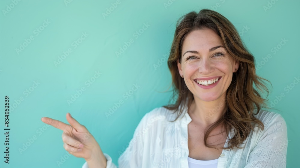Woman Smiling and Pointing to the Side Woman Smiling and Pointing to the Side